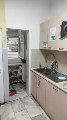 a kitchen with a sink and a refrigerator at Стая лидер хаус in Varna City