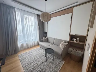 a living room with a couch and a table at Azure View in Burgas City
