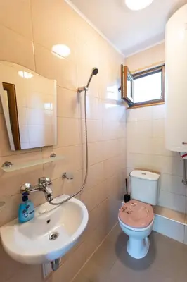 a bathroom with a sink and a toilet at Бунгала Гнездото Bungalows The Nest Lozenets 2 in Lozenets