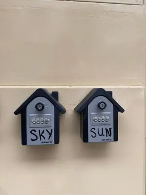 two clocks on the side of a wall at Sun in Varna City