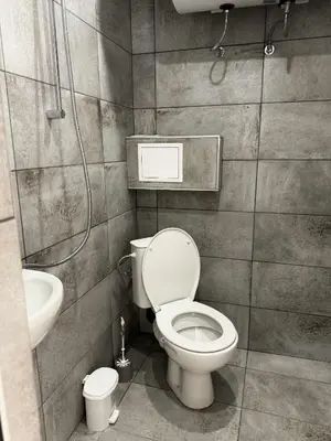 a bathroom with a toilet and a sink at Sky in Varna City