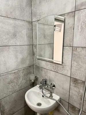 a bathroom with a sink and a mirror at Sky in Varna City