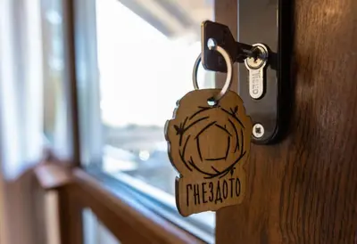 a wooden padlock on a door in a room at Бунгала Гнездото Bungalows The Nest 1 in Lozenets