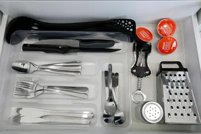 a plastic container with utensils in a drawer at The Corner Studio in Varna City
