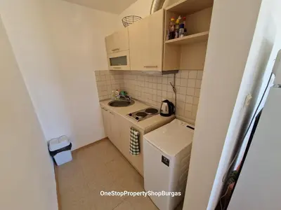 a small kitchen with a sink and a washing machine at Ravda Holiday Village 1-bed seaview apartment in Ravda