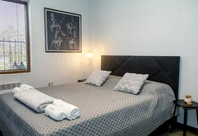 a bedroom with a bed with towels on it at Cozy Flat with Two Bedrooms in Central Varna by Flat Mаnаger in Varna City