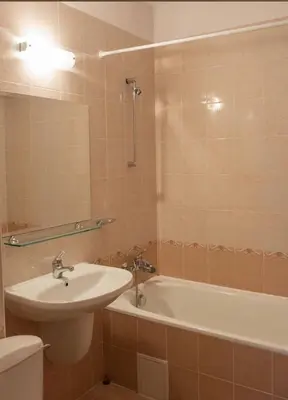 a bathroom with a sink and a bath tub at Excelsior Apartment in Sunny Beach