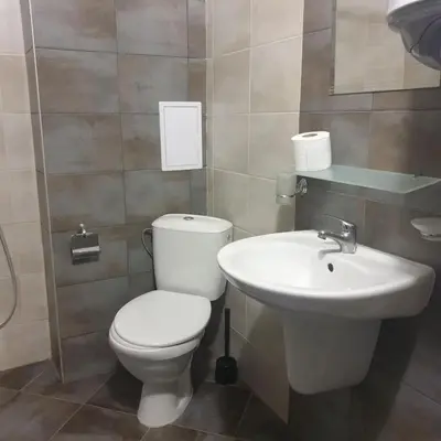 a bathroom with a toilet and a sink at The White Houses 7 in Nesebar