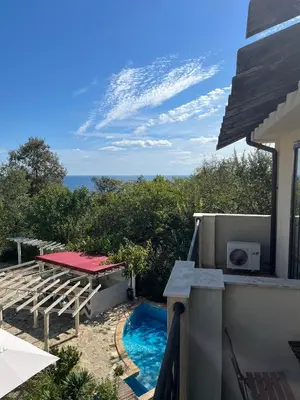 a swimming pool with a view of the ocean at Eco Apartment Cliff in Obzor