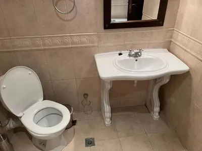 a bathroom with a toilet and a sink at Eco Apartment Cliff in Obzor
