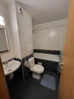 a bathroom with a toilet and a sink and a tub at Garden of Eden studio in Sveti Vlas