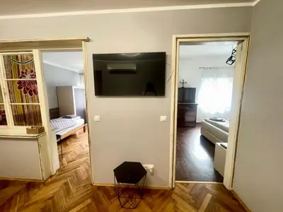 a room with a mirror and a room with a bed at 'Golden Bird' Apartment, 2 Bedrooms, Super Central in Burgas City