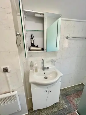 a bathroom with a sink and a mirror at 'Sea South' Apartment, Super Central, Vintage Style, 1BDR in Burgas City