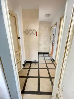 a hallway in a house with a tile floor at 'Sea South' Apartment, Super Central, Vintage Style, 1BDR in Burgas City