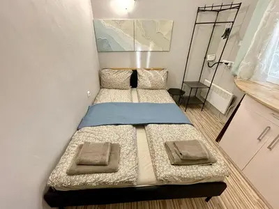 a small room with two beds in it at 'The Conch' Room with Private Entrance and Bathroom in Burgas City