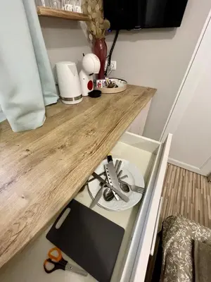 a kitchen with a wooden counter top with a stove at 'The Conch' Room with Private Entrance and Bathroom in Burgas City