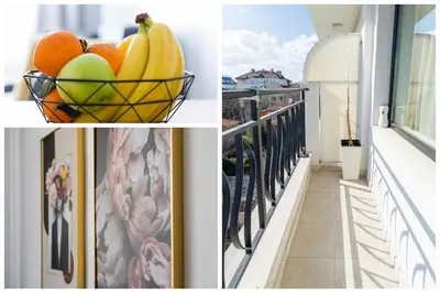 a basket of fruit sitting on a balcony at Chic Downtown Flat in Varna City