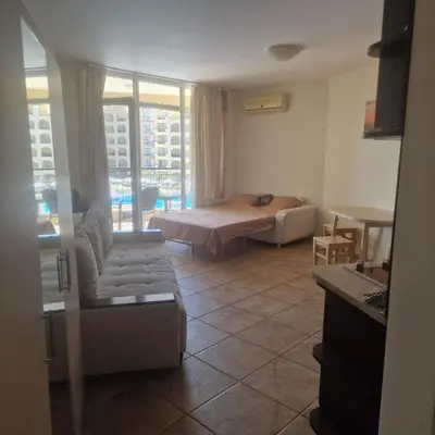a living room with a bed and a couch at Charming Studio at the Seaside in Aheloy