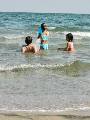 a group of people in the water at the beach at Charming Studio at the Seaside in Aheloy