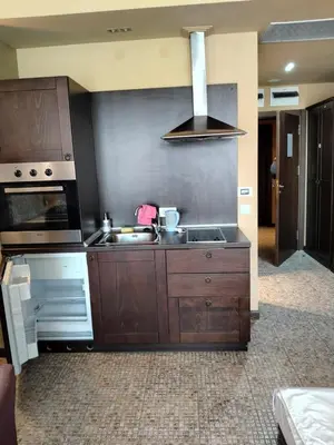 a kitchen with a sink and a stove at Studio Royal Beach Barcello in Sunny Beach