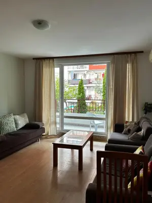 a living room with a couch and a coffee table at Have a Good Rest Apartments in Sveti Vlas