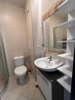 a bathroom with a white toilet and a sink at Coastera Group Cascadas 8 in Sunny Beach