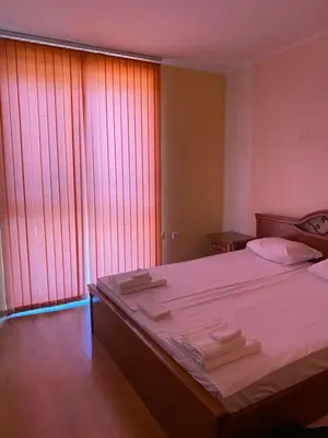 a bedroom with a large bed and a large window at Sunny Home 2 in Sunny Beach