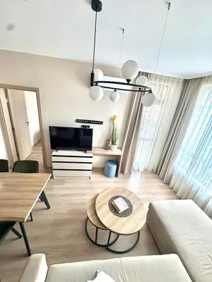 a living room with a couch and a table at Sorrento Sole Mare Sveti Vlas in Sveti Vlas