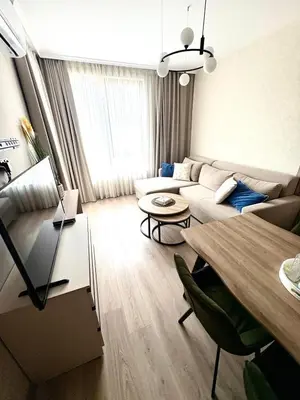 a living room with a couch and a table at Sorrento Sole Mare Sveti Vlas in Sveti Vlas