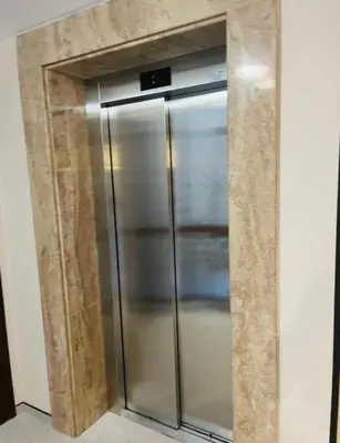 a stainless steel refrigerator in the corner of a room at Sorrento Sole Mare Sveti Vlas in Sveti Vlas