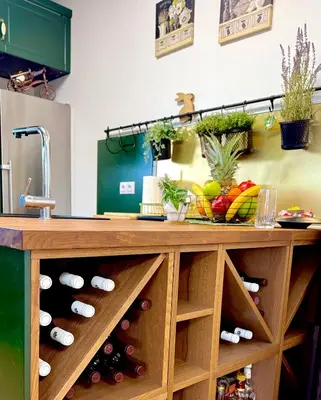 a kitchen with a counter with wine bottles at Вила Лонгоз