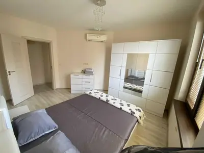 a small bedroom with a bed and a dresser at Апартамент в затворен комплекс Артур гр Свети Влас in Sveti Vlas