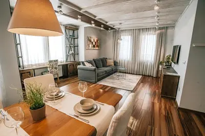 a living room with a table and a couch at Desing Flat n2 Port - Designer - Own Parking - Streaming - 2 baths - Wash&Dry in Burgas City