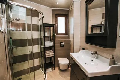 a bathroom with a sink and a shower and a toilet at Desing Flat n2 Port - Designer - Own Parking - Streaming - 2 baths - Wash&Dry in Burgas City