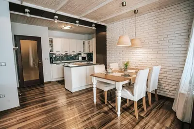 a kitchen and dining room with a table and chairs at Desing Flat n2 Port - Designer - Own Parking - Streaming - 2 baths - Wash&Dry in Burgas City
