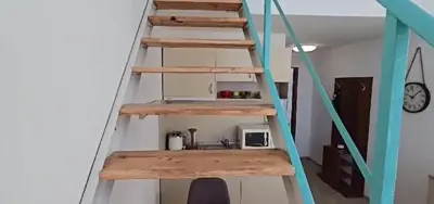 a ladder leading up to a room with a sink at Seaview apartment with garden & pool in Sunny Beach