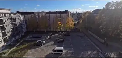 an aerial view of cars parked in a parking lot at Seaview apartment with garden & pool in Sunny Beach