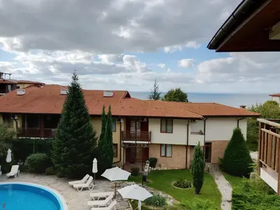 a villa with a swimming pool and a house at Garden of Eden - M303 Rey&Mar Apartaments in Sveti Vlas