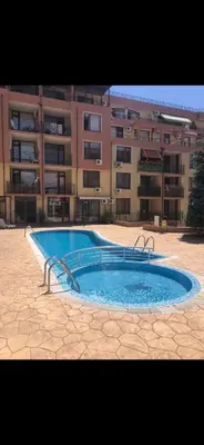 a large swimming pool in front of a building at Siana3 in Sveti Vlas