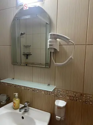 a bathroom with a sink and a mirror at Siana3 in Sveti Vlas