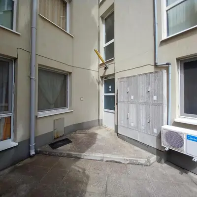 a hallway of a building with a gate and a door at Home Comfort in Sunny Beach