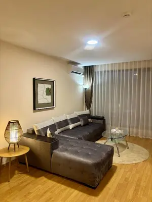 a living room with a couch and a table at Luxury Premier Fort Beach in Sveti Vlas