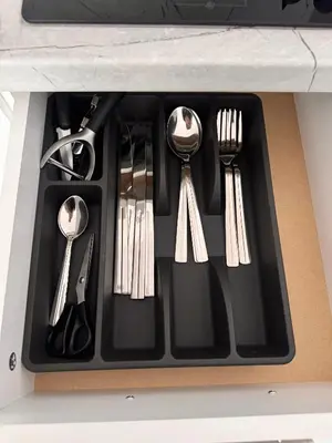 a black tray with silver utensils in a drawer at Studio Sea Breeze Sveti Vlas ap58 in Sveti Vlas