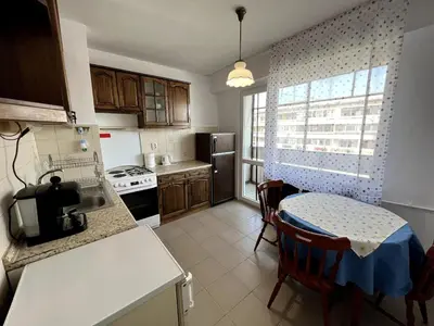 a kitchen with a table and a counter top at Home for you, 2-bedroom apartment in Burgas City