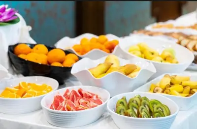 a table with bowls of different types of fruit at Garden of Eden - Panorama C15 Rey&Mar in Sveti Vlas