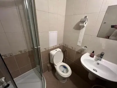 a bathroom with a toilet and a sink and a shower at Camping Gradina Sunny Bay Appartment in Chernomorets