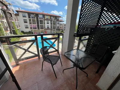 two chairs and a table on a balcony at Camping Gradina Sunny Bay Appartment in Chernomorets