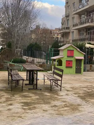 two benches and a picnic table in a park at Balkan Breeze 7 - Rey&Mar Apartaments in Sunny Beach