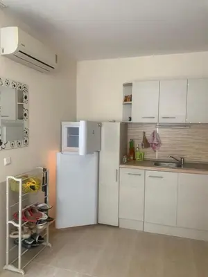 a kitchen with white cabinets and a white refrigerator at Balkan Breeze 7 - Rey&Mar Apartaments in Sunny Beach