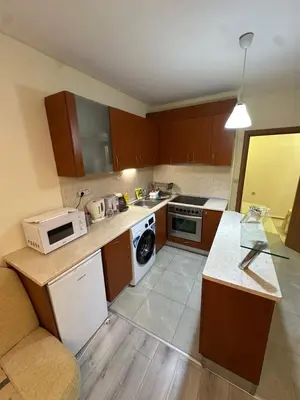 a small kitchen with a stove and a sink at Apartment near the sea in Pomorie
